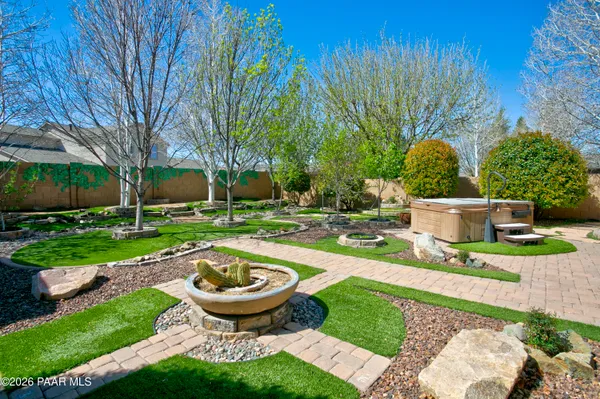a view of a backyard with sitting area