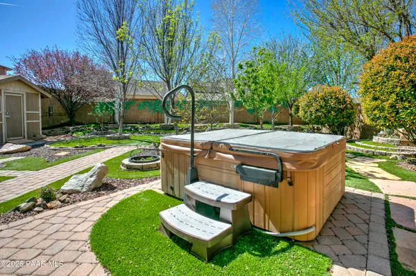 a view of a backyard with swimming pool