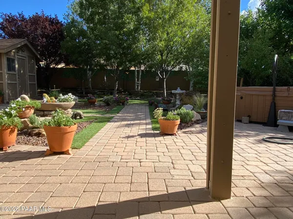 a view of a backyard with sitting area