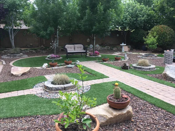 a table and chairs in the garden