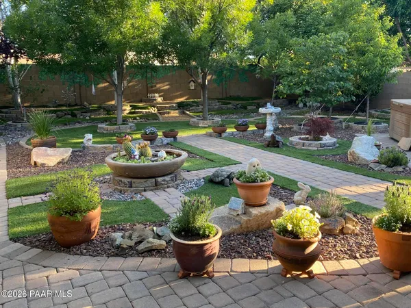 a front view of a house with sitting area and fire pit