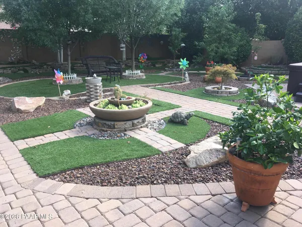 a view of a backyard with garden