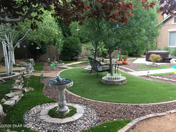 a view of a garden with a fountain