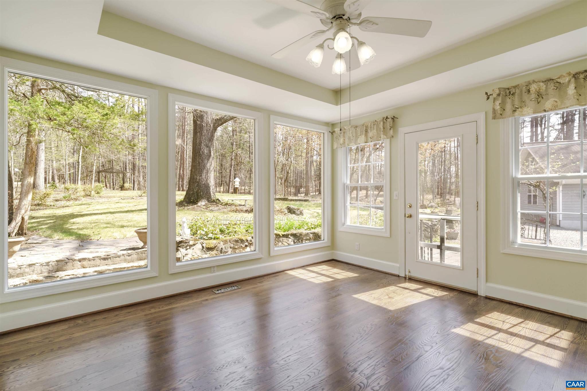 5695 Free Union Road Free Union, VA 22940 - Photo 15 of 68 a view of an empty room with wooden floor and a window