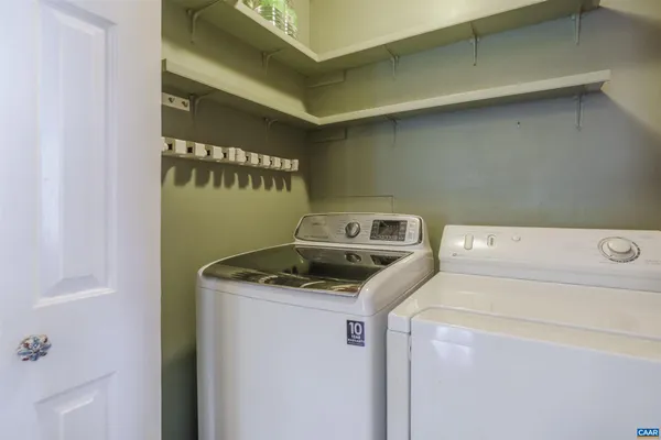 a view of a room with wooden floor and windows