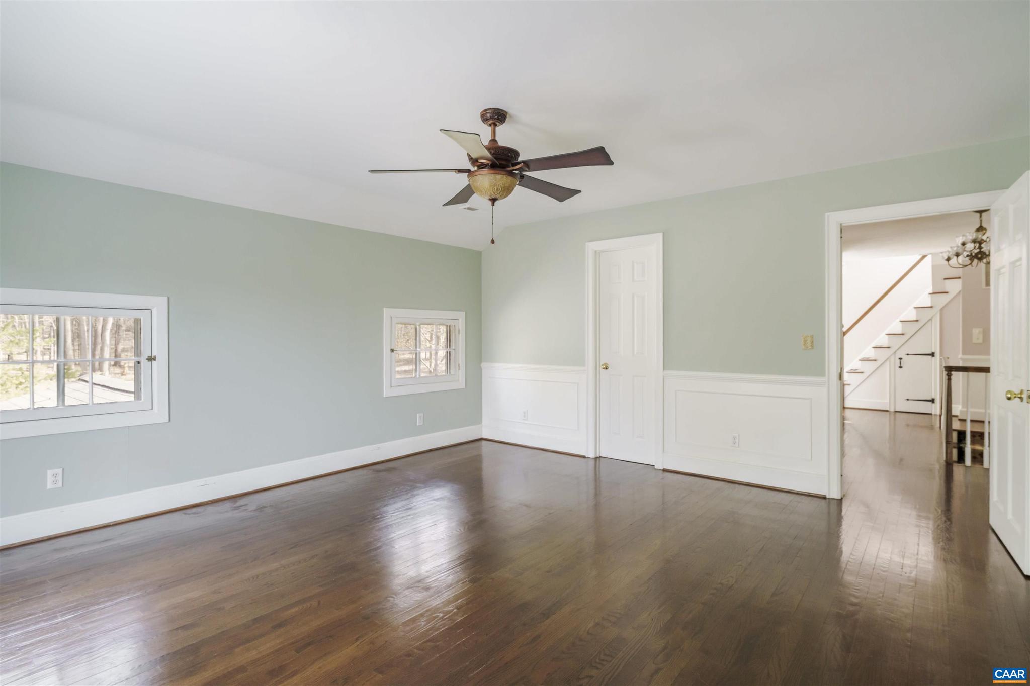 5695 Free Union Road Free Union, VA 22940 - Photo 29 of 68 a view of empty room with wooden floor and fan