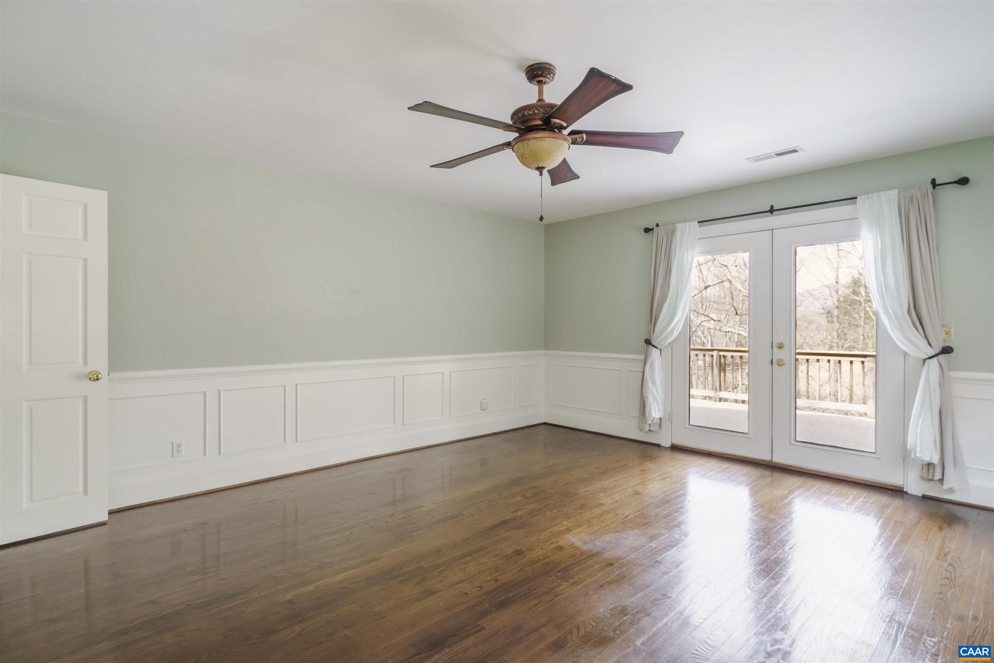 5695 Free Union Road Free Union, VA 22940 - Photo 31 of 68 a view of an empty room with a window and wooden floor