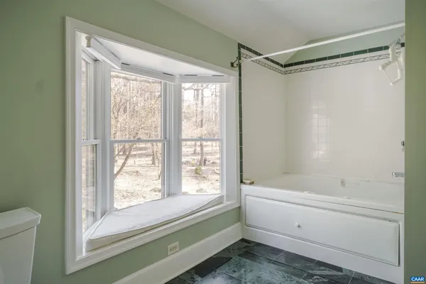 a room with gym equipment and a large window