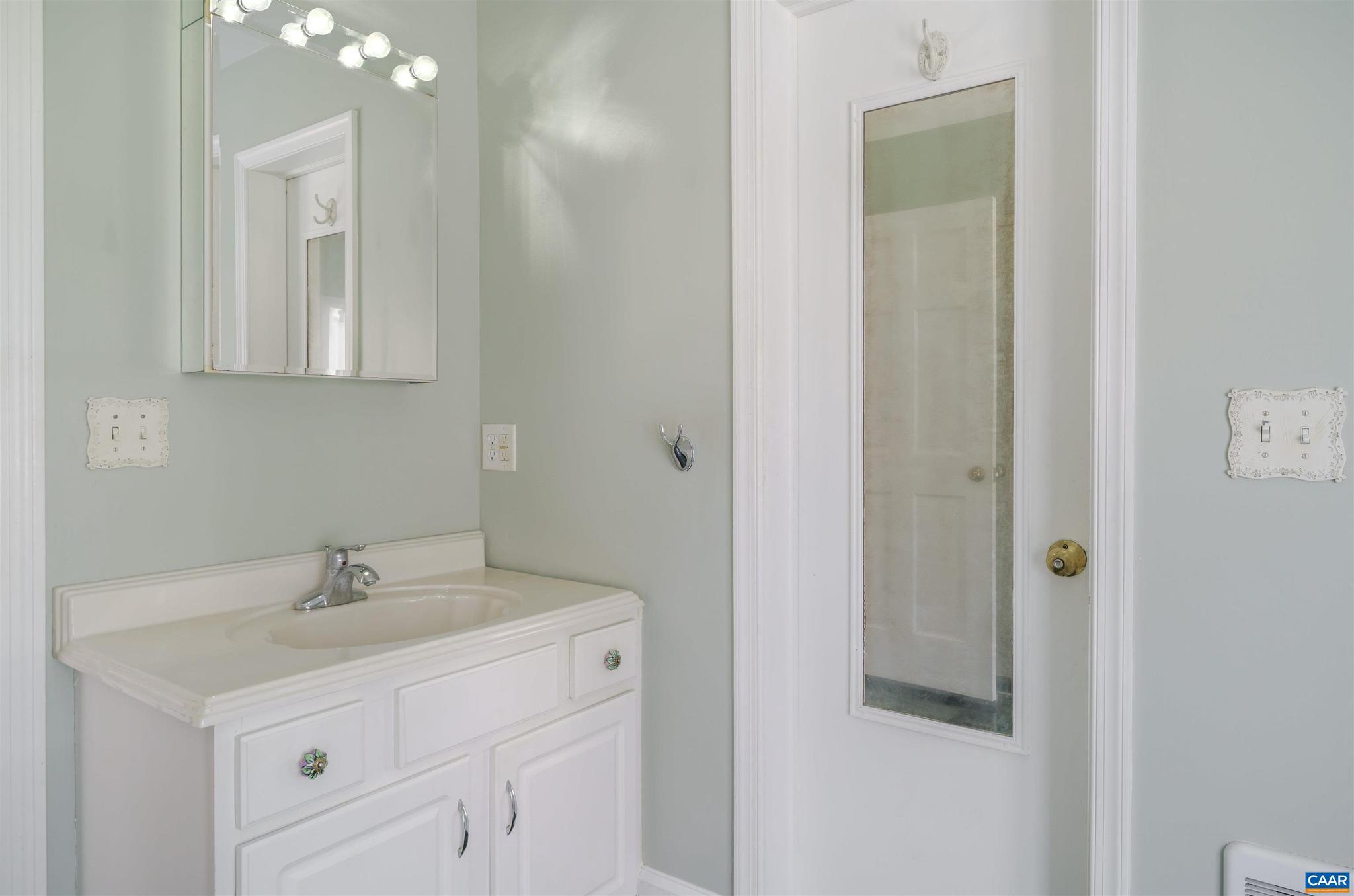 5695 Free Union Road Free Union, VA 22940 - Photo 37 of 68 a bathroom with a sink a vanity and a mirror