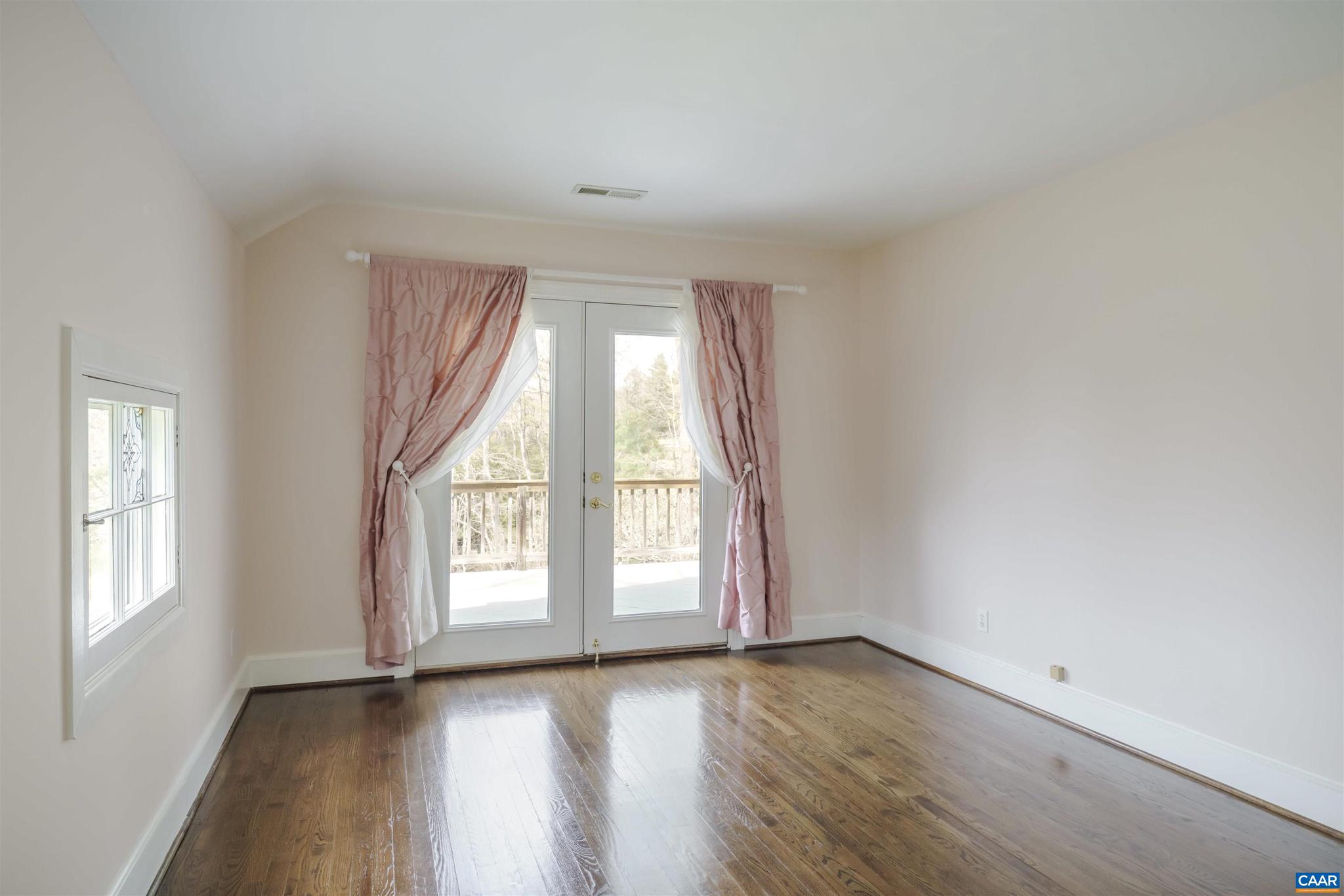 5695 Free Union Road Free Union, VA 22940 - Photo 39 of 68 an empty room with wooden floor and windows
