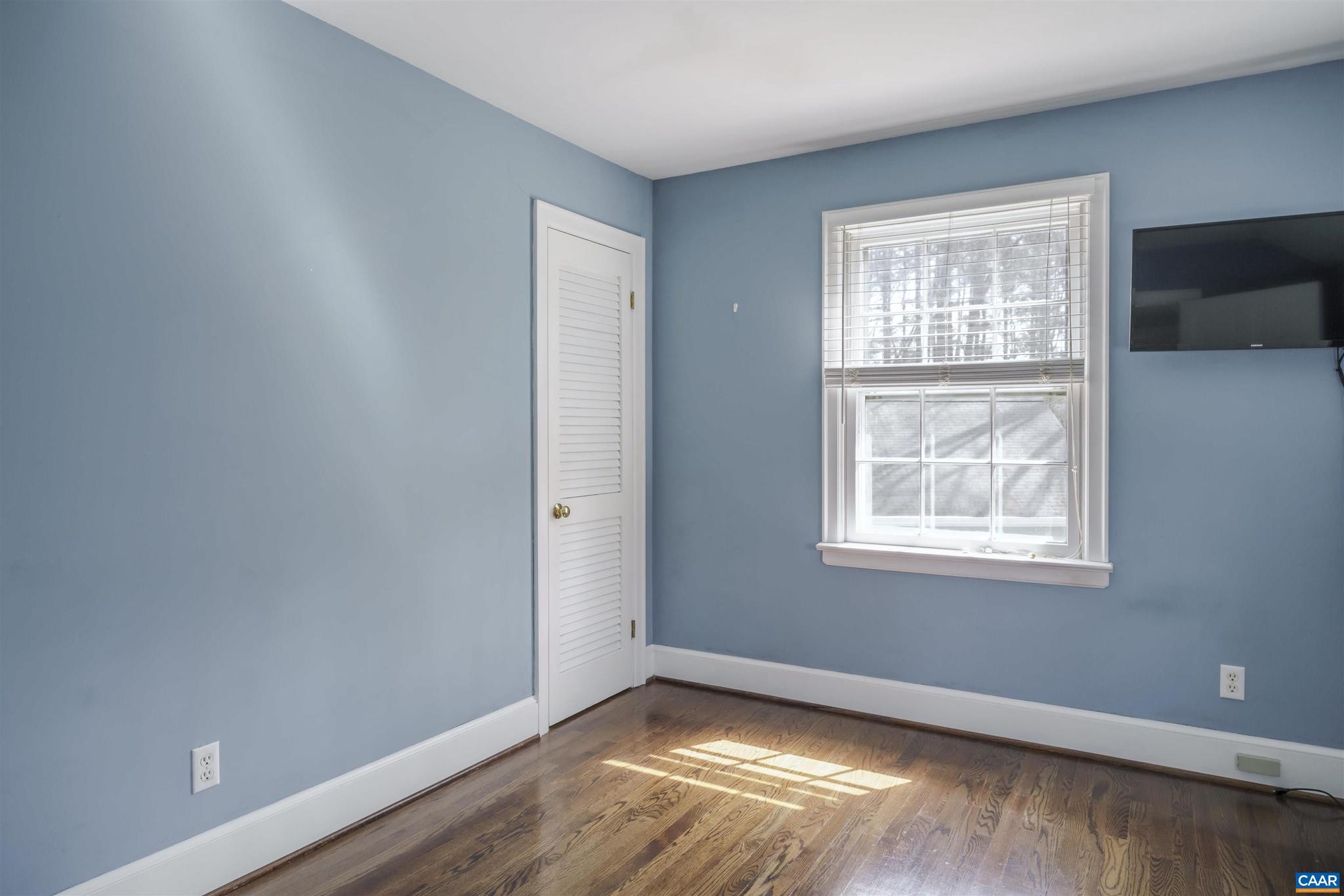 5695 Free Union Road Free Union, VA 22940 - Photo 42 of 68 a view of an empty room with wooden floor and a window