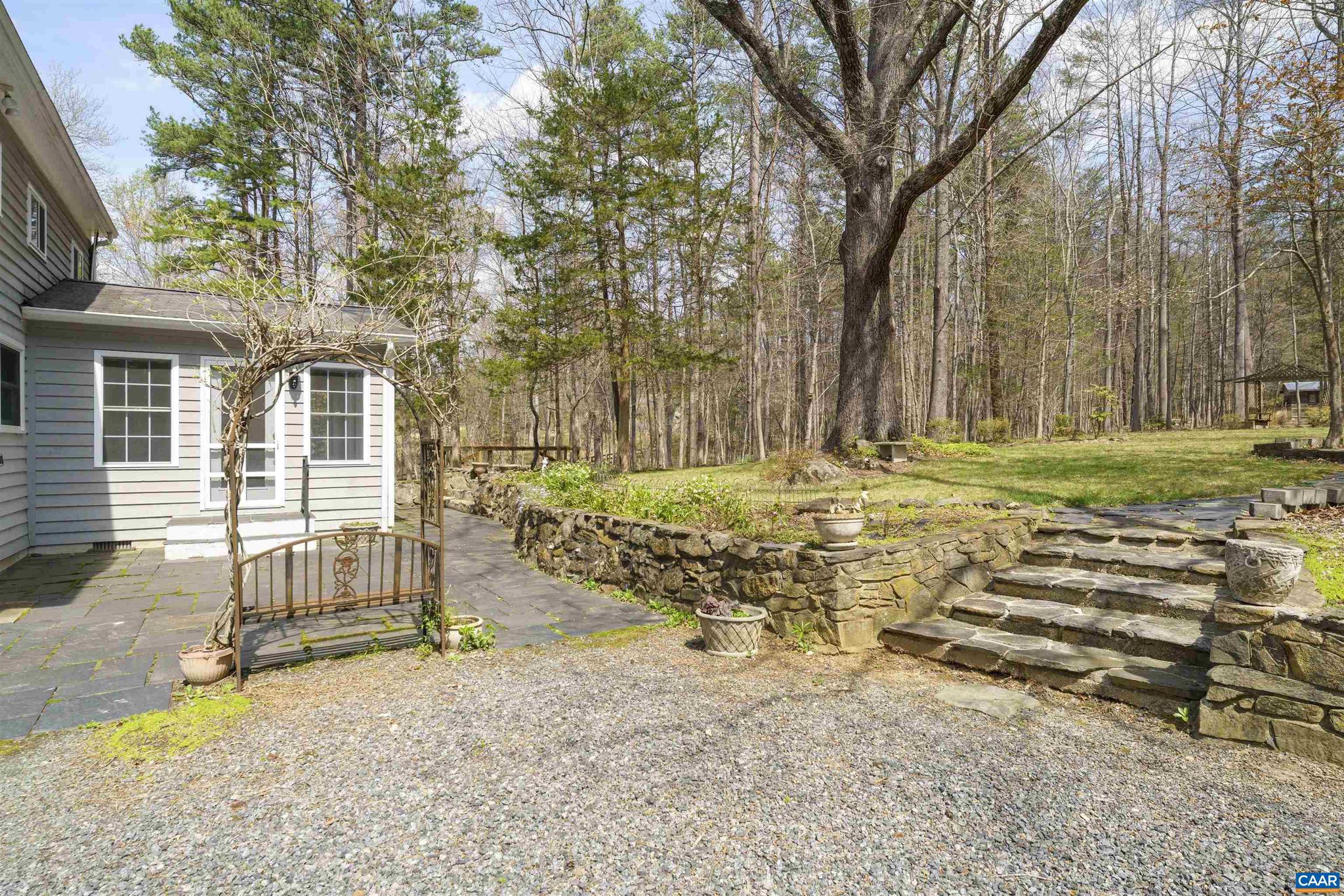 5695 Free Union Road Free Union, VA 22940 - Photo 46 of 68 a view of a house with backyard and trees