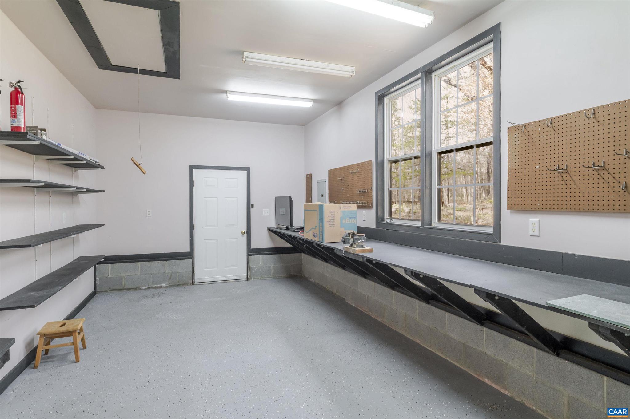 5695 Free Union Road Free Union, VA 22940 - Photo 57 of 68 a room with gym equipment and a large window