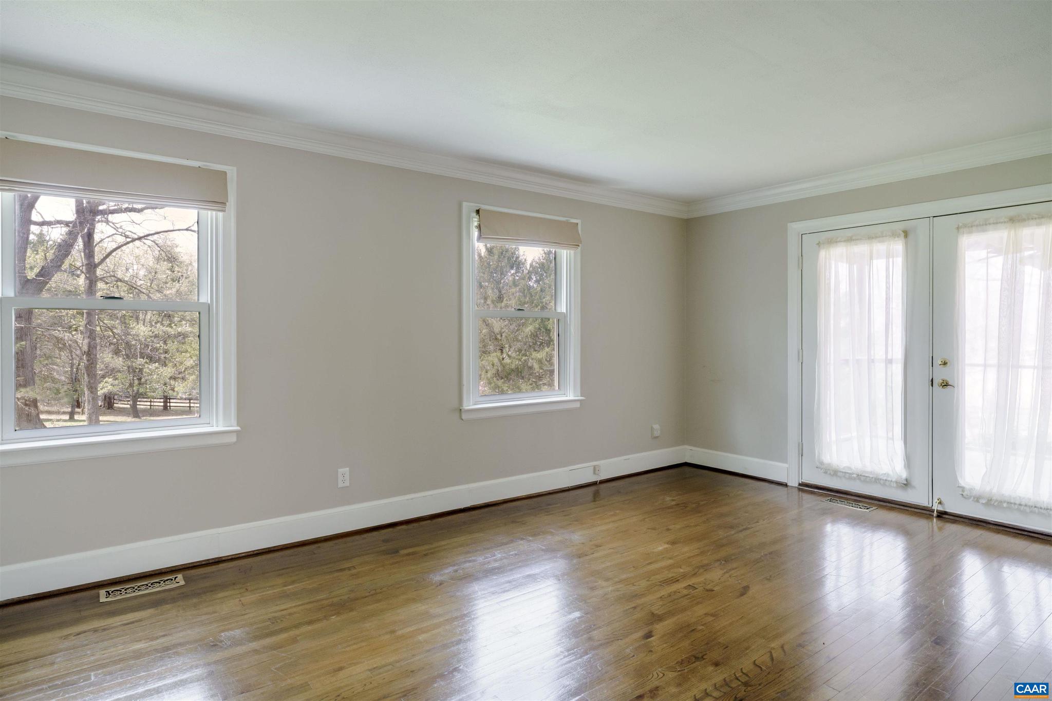 5695 Free Union Road Free Union, VA 22940 - Photo 8 of 68 a view of an empty room with wooden floor and a window