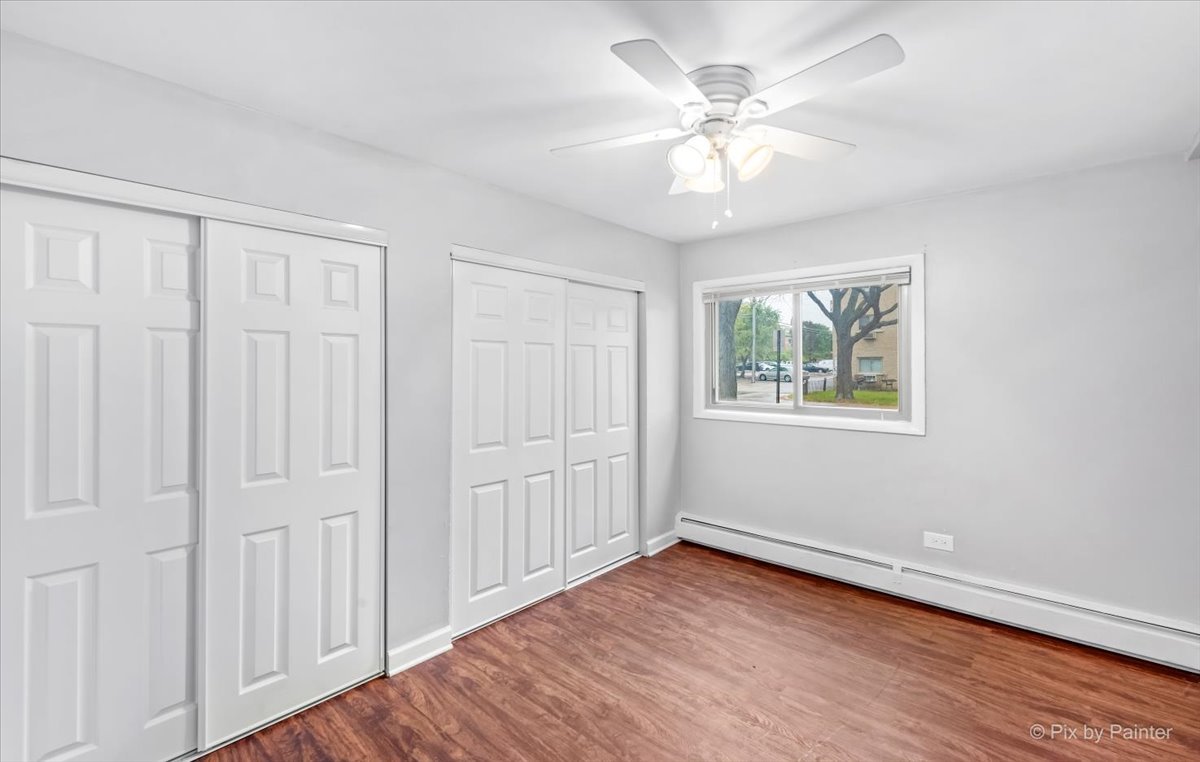 1080 North Wheeling Road, Unit 3B Mount Prospect, IL 60056 - Photo 6 of 8 wooden floor in an empty room with a window
