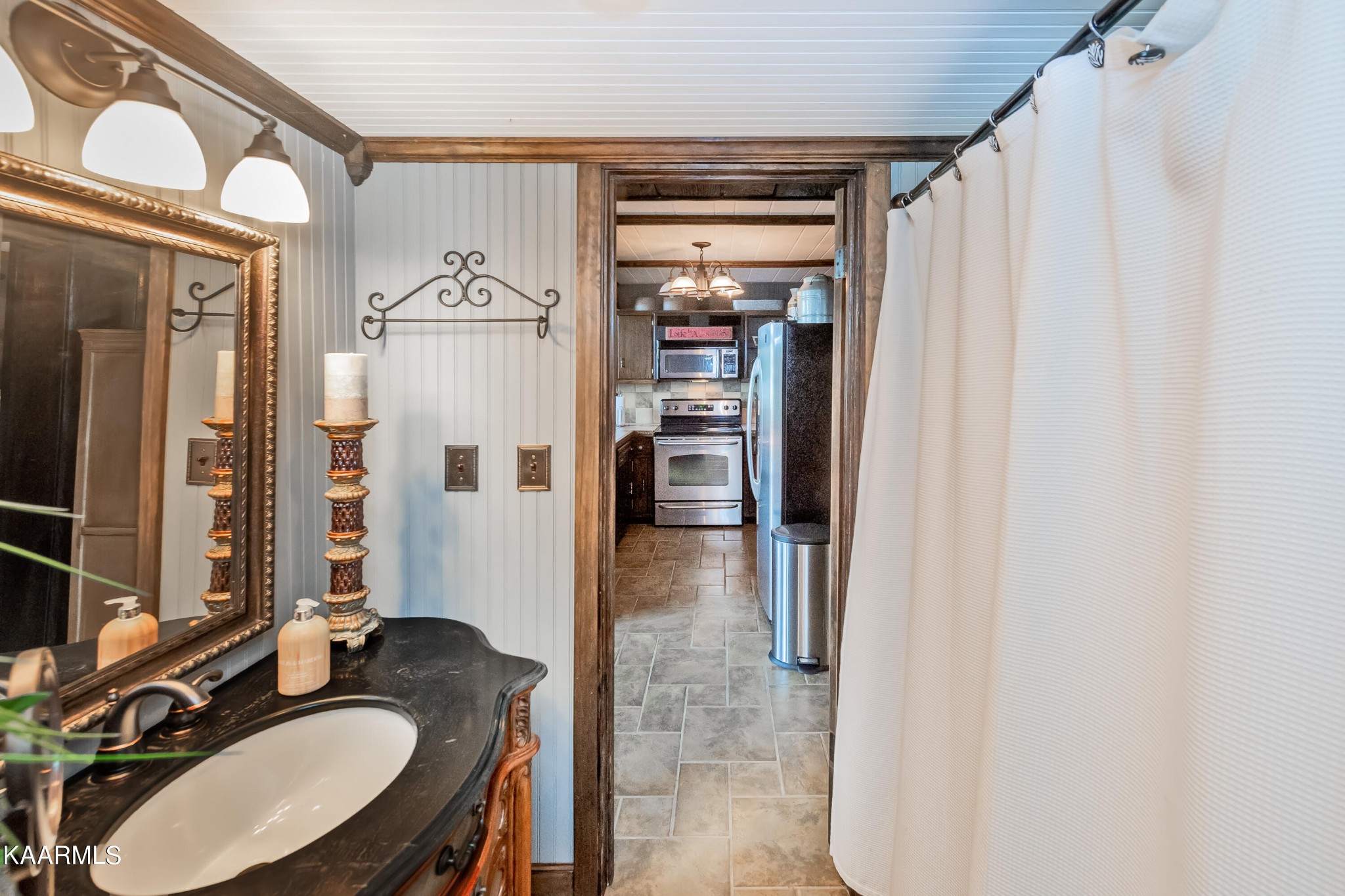 4292 River Road Ten Mile, TN 37880 - Photo 24 of 40 a en suite bathroom with a granite countertop sink and a mirror