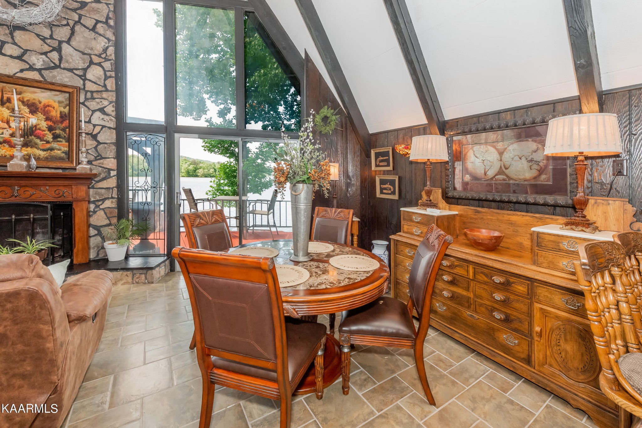 4292 River Road Ten Mile, TN 37880 - Photo 7 of 40 a dining room with furniture a fireplace and a chandelier
