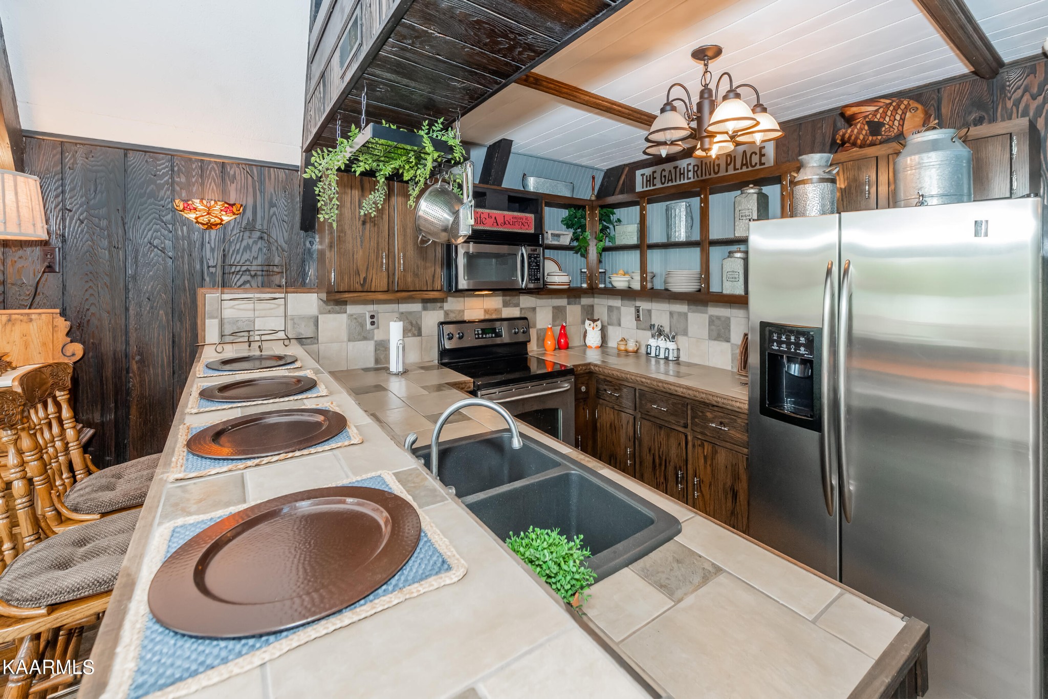 4292 River Road Ten Mile, TN 37880 - Photo 10 of 40 a kitchen filled with stainless steel appliances granite countertop a sink and a refrigerator