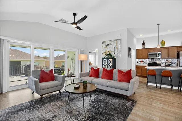 a living room with furniture and a large window