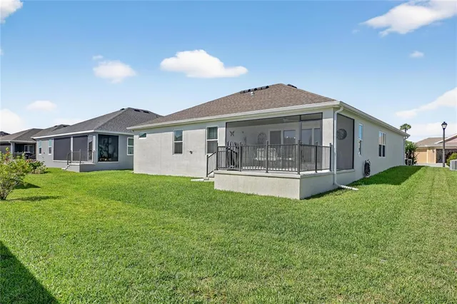 a view of house with yard and porch