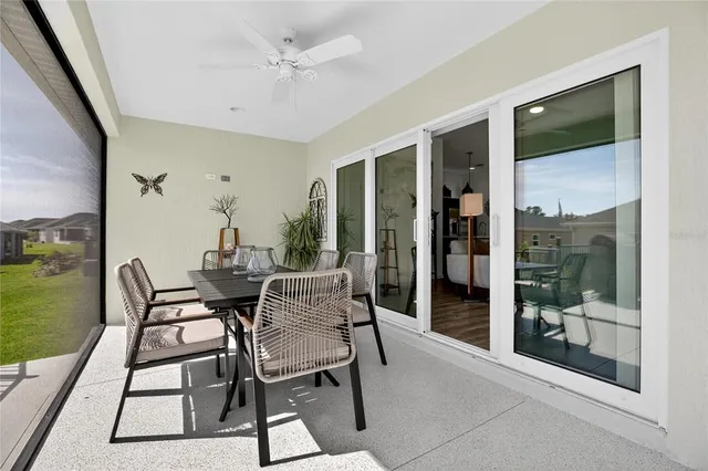 a dining room with furniture and window