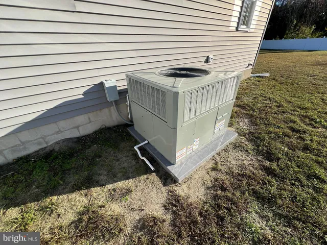 a view of a backyard with sitting area