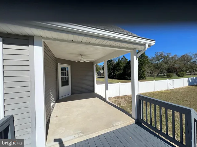 a view of balcony with furniture