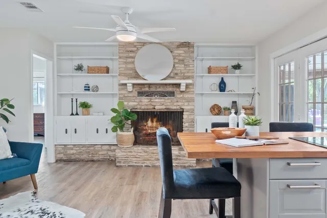 a living room with furniture and a fireplace