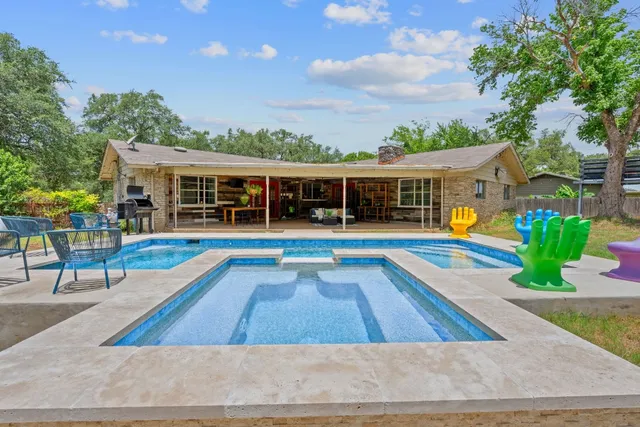 a view of a house with a swimming pool