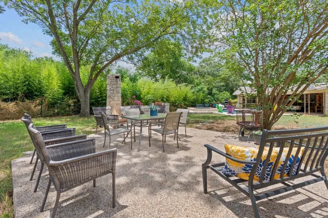 a view of a chairs and tables in the patio