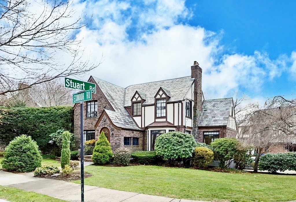 a view of a house next to a yard