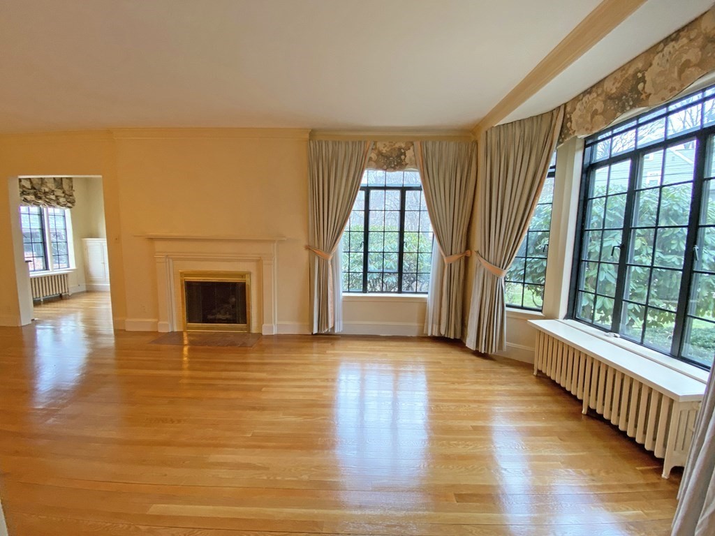 3 Exmoor Road Newton, MA 02459 - Photo 16 of 41 a view of empty room with wooden floor and fireplace