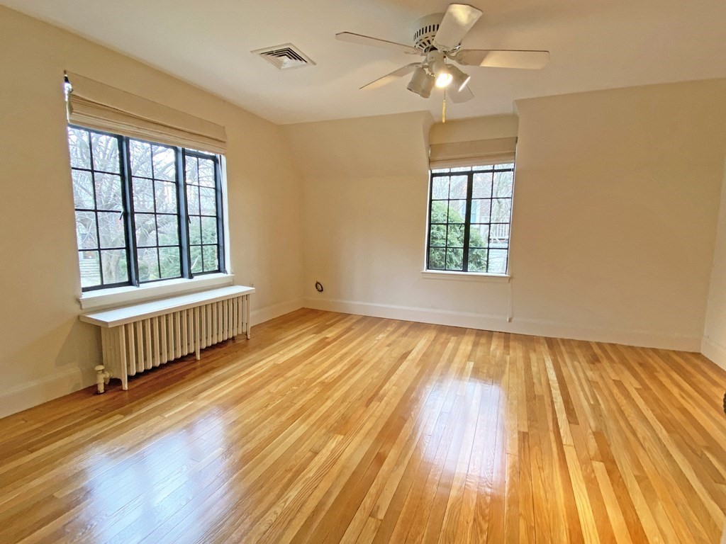 3 Exmoor Road Newton, MA 02459 - Photo 26 of 41 a view of an empty room with wooden floor and a window