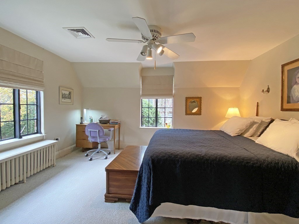 3 Exmoor Road Newton, MA 02459 - Photo 27 of 41 a bedroom with a bed and a chandelier