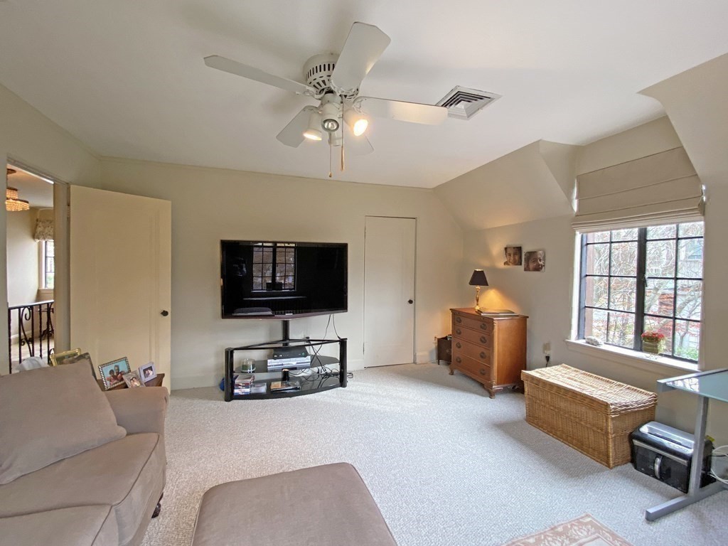 3 Exmoor Road Newton, MA 02459 - Photo 29 of 41 a living room with furniture and a flat screen tv