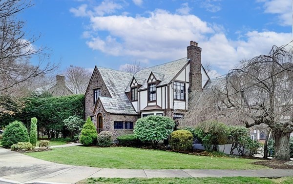 3 Exmoor Road Newton, MA 02459 - Photo 3 of 41 a front view of a house with a yard and lake view