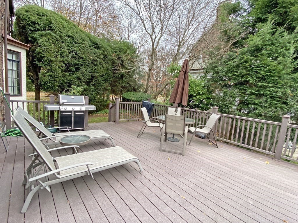 3 Exmoor Road Newton, MA 02459 - Photo 35 of 41 a view of house with deck outdoor seating and trees
