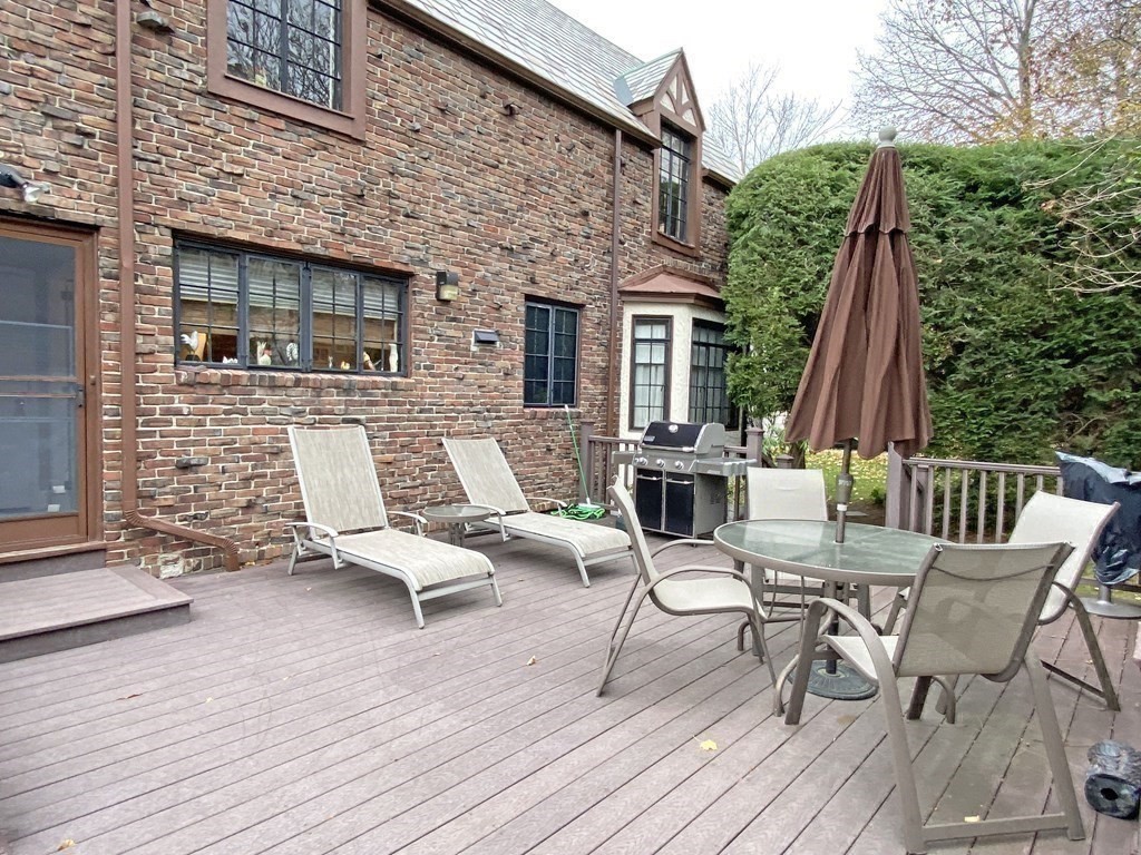 3 Exmoor Road Newton, MA 02459 - Photo 36 of 41 a view of a patio with couple of chairs and a wooden floor