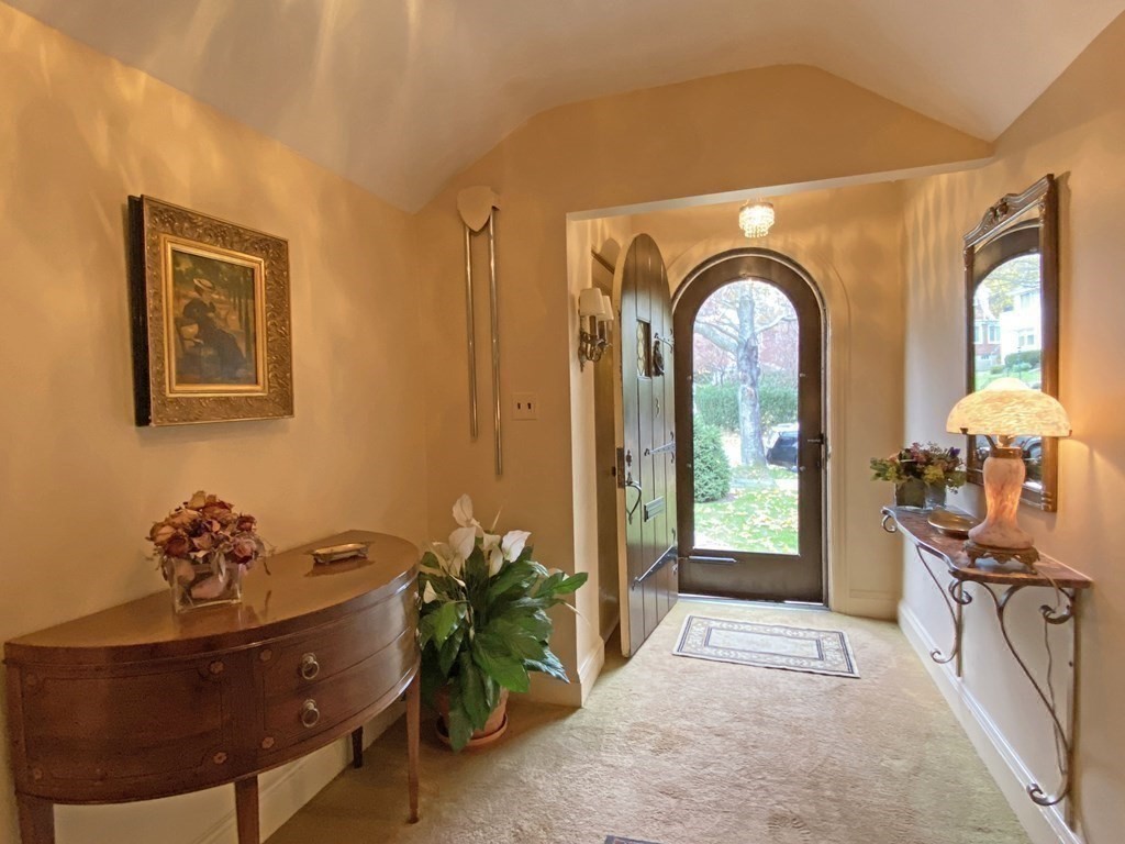 3 Exmoor Road Newton, MA 02459 - Photo 6 of 41 a view of a entryway with furniture and floor to ceiling window