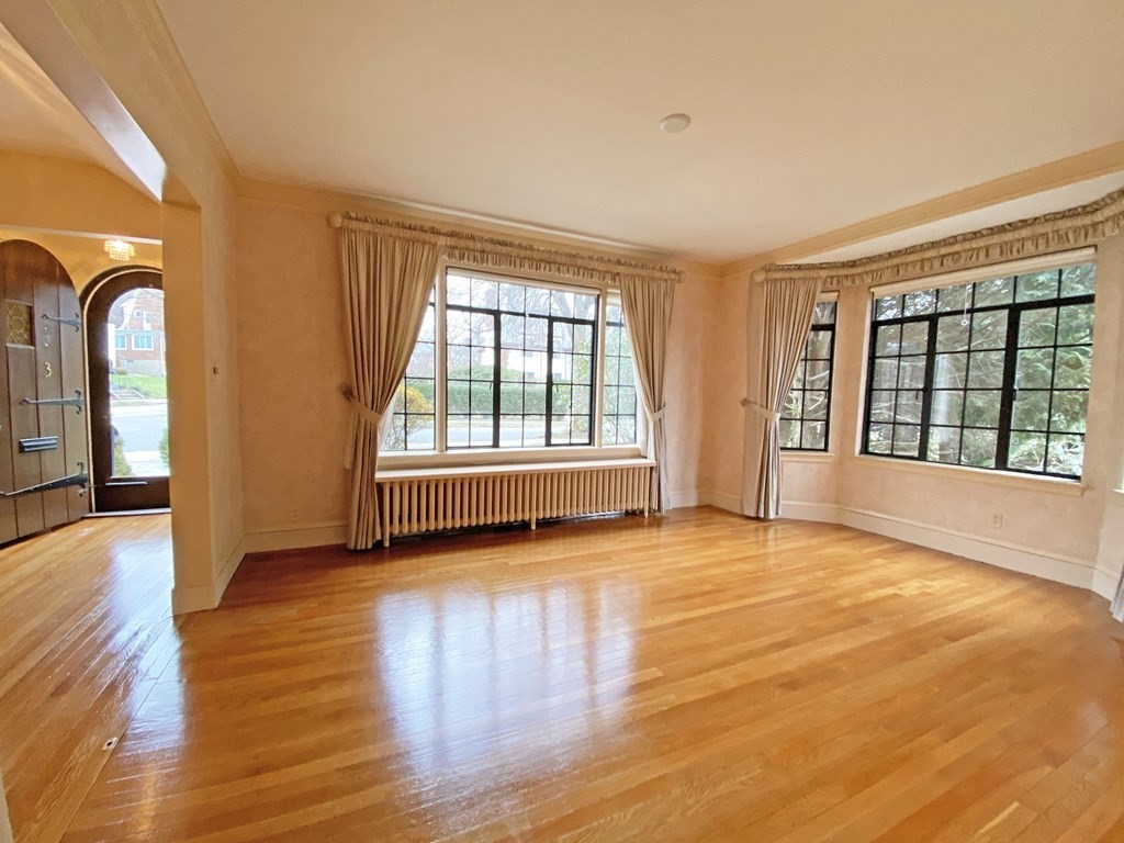 3 Exmoor Road Newton, MA 02459 - Photo 10 of 41 a view of an empty room with window and wooden floor