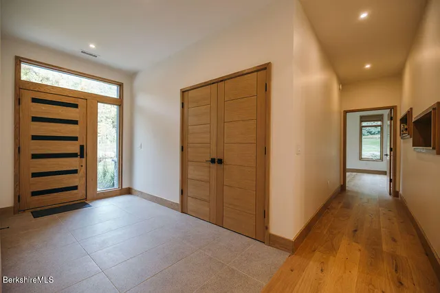 a view of room with hallway and stairs