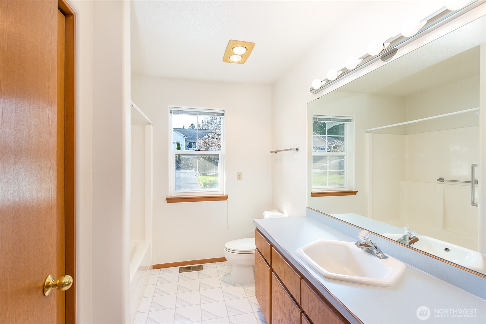 170 Hurricane Ridge Drive Sequim, WA 98382 - Photo 29 of 39 a bathroom with a sink a toilet and a window