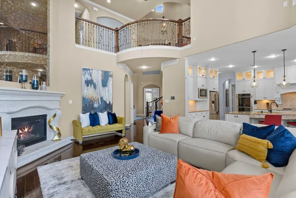 a living room with furniture and a fireplace