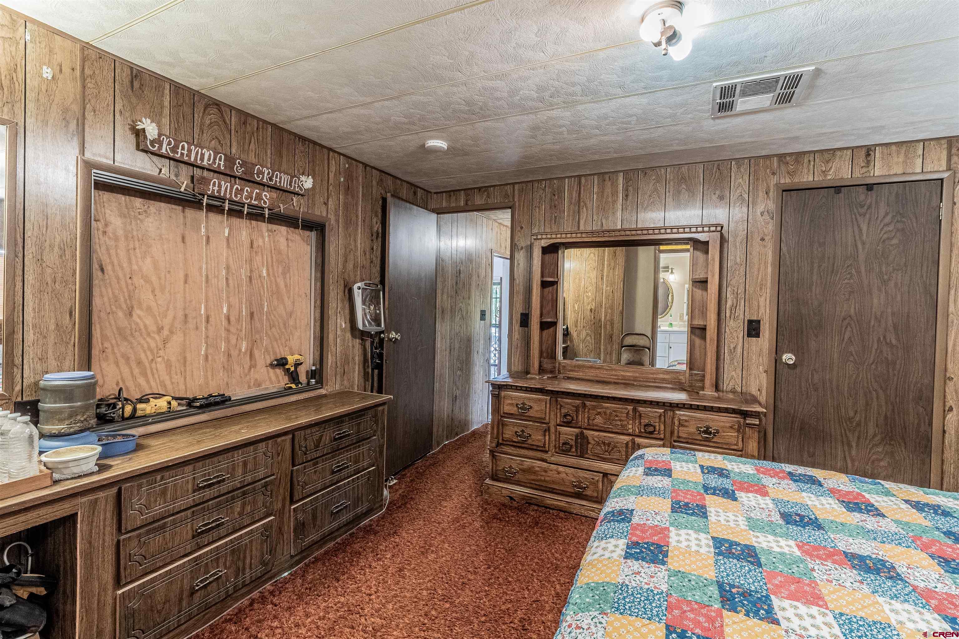 16923 Highway 550 Aztec, NM 87410 - Photo 15 of 45 a bathroom with a sink and a mirror