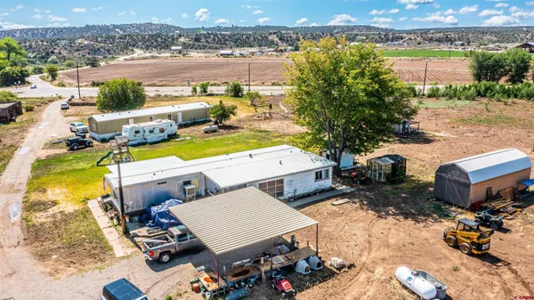 an aerial view of a house with outdoor space