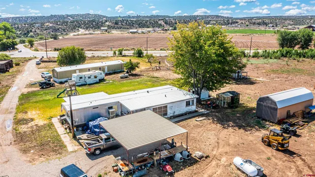 an aerial view of a house with outdoor space
