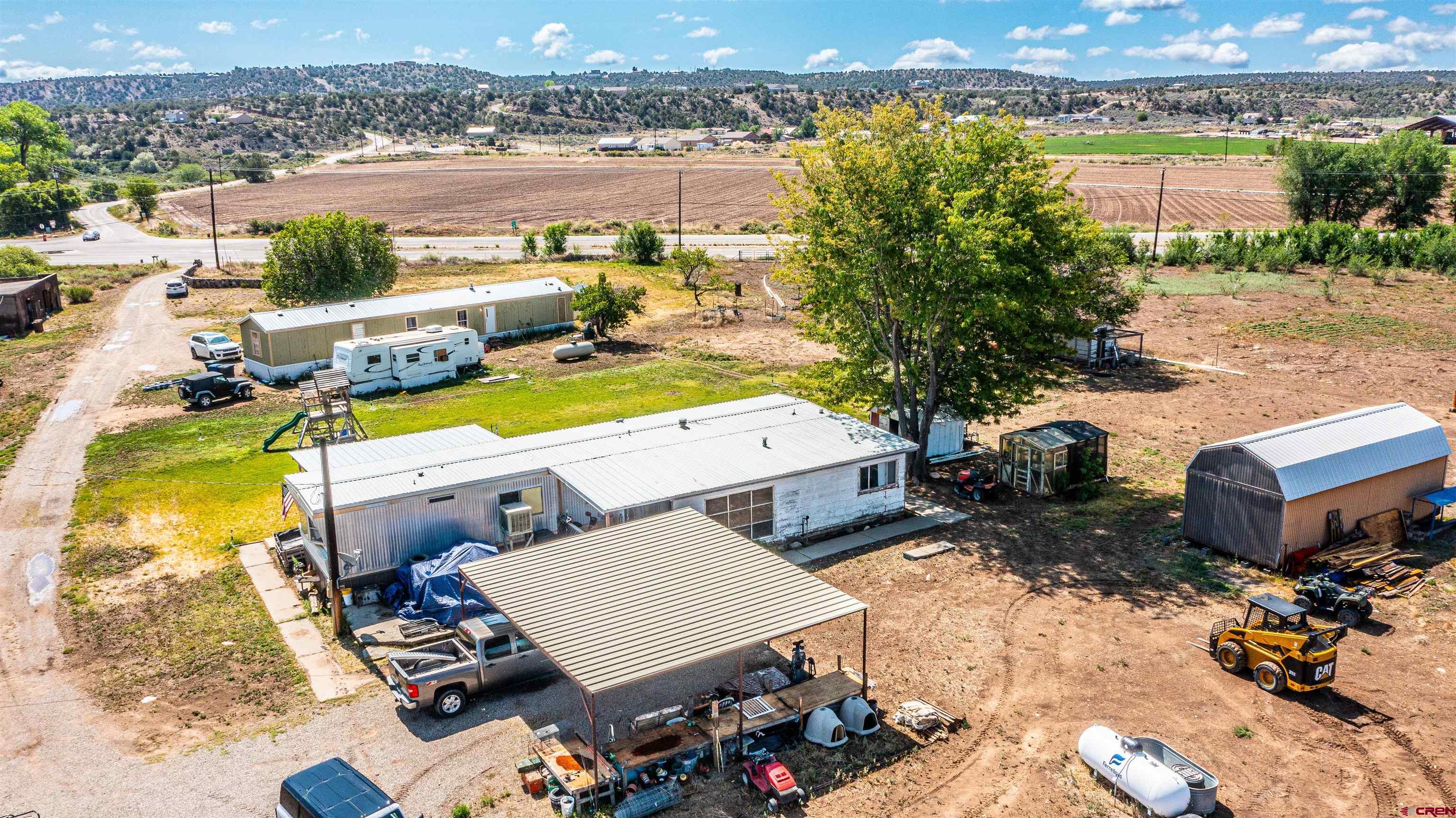 16923 Highway 550 Aztec, NM 87410 - Photo 3 of 45 an aerial view of a house with outdoor space