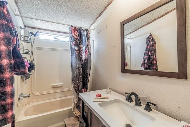 a living room with lots of furniture and a flat screen tv