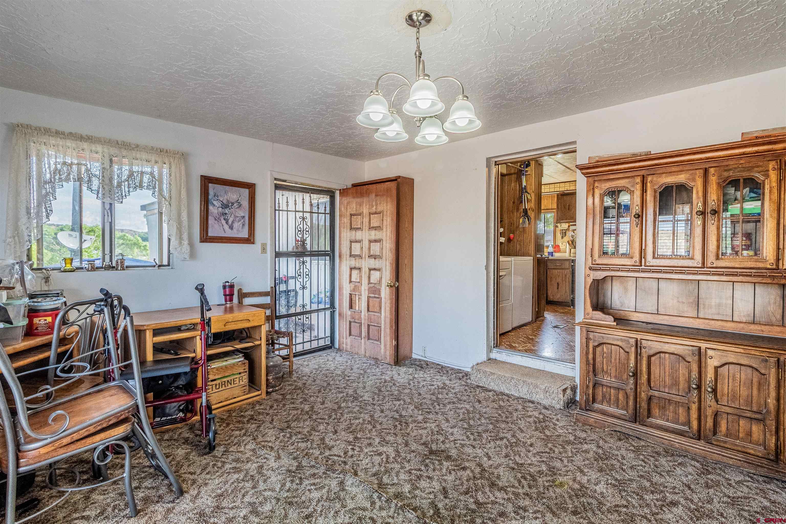 16923 Highway 550 Aztec, NM 87410 - Photo 7 of 45 a view of a dining room with furniture window and outside view