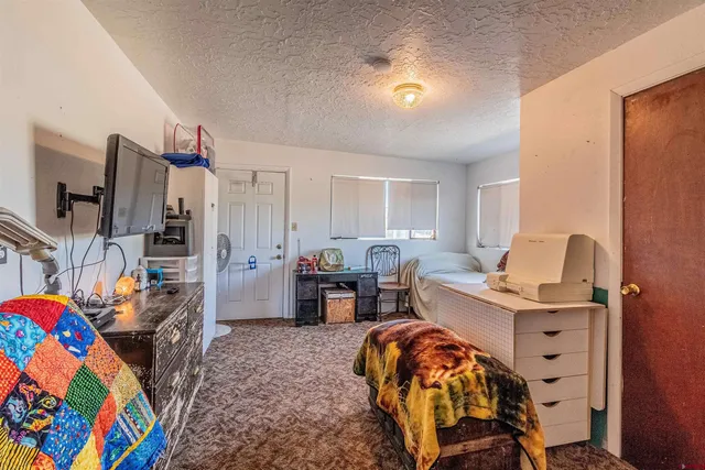 a workspace with furniture and bedroom